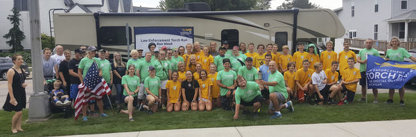 Torch runners beat storm back to the finish line